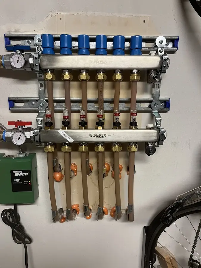 Plumber performing Water Heater Repair at a residential property in Wyckoff